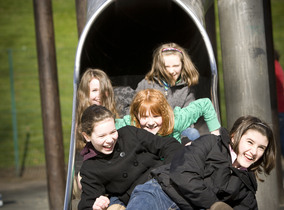 Children playing on a slide