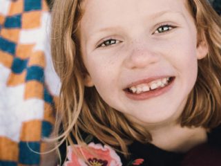 Strawberry blonde girl smiling