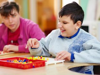 Children playing with plastic pins