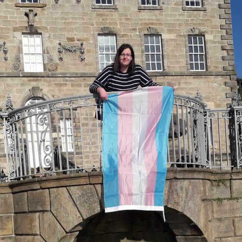 luna holding transgender flag