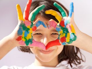 Young girl with finger paints