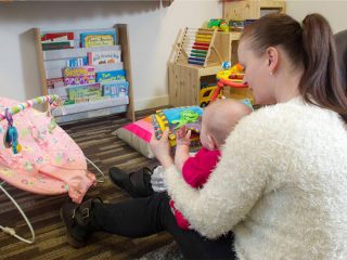 Mother and child playing on the floor