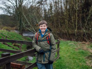 Young Scottish boy outside smiling