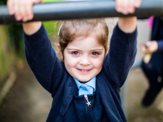 young girl wearing her school uniform